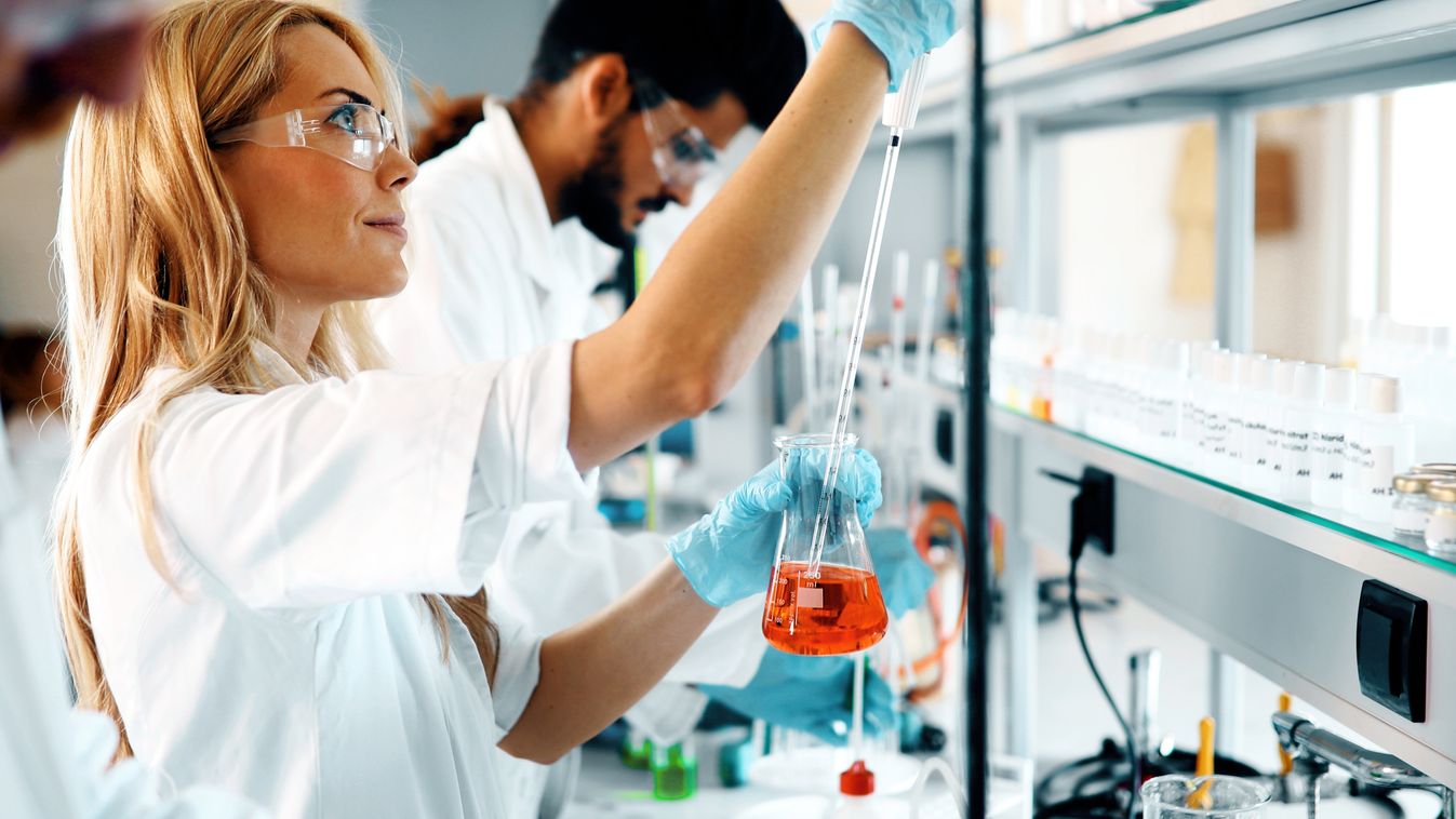 Female student of chemistry working in laboratory science laboratory woman chemistry study student lab chemist technician scientist biology researcher chemical equipment professional research female worker coat looking glasses white biochemistry experimen