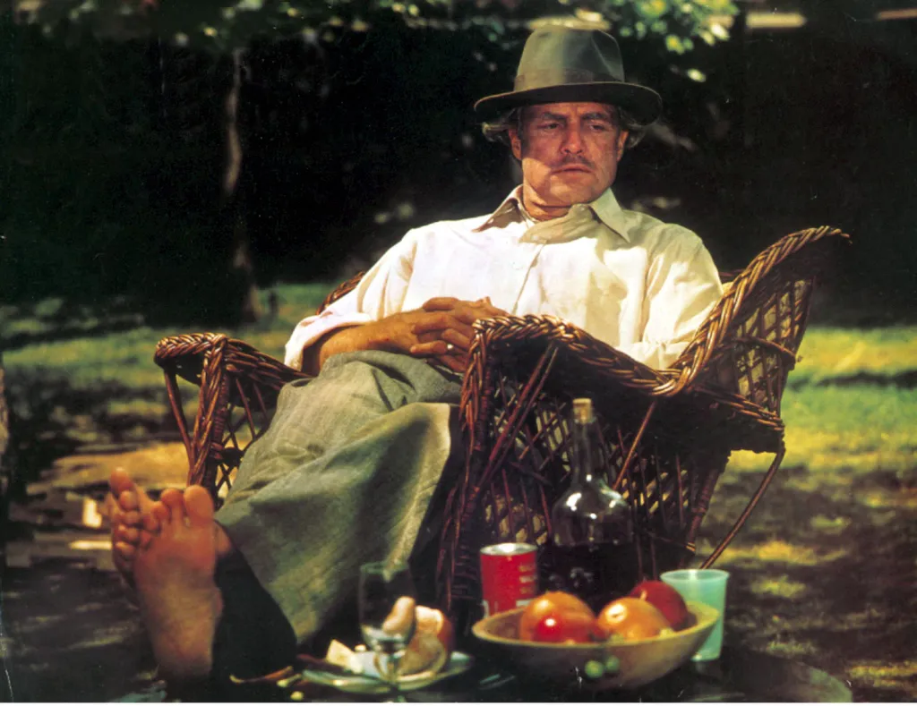 The Godfather (1972) USA Cinema USA Cane-chair Rattan Barefoot Crossed hands Outside Horizontal MAN ARMCHAIR HAT GARDEN FRUIT 