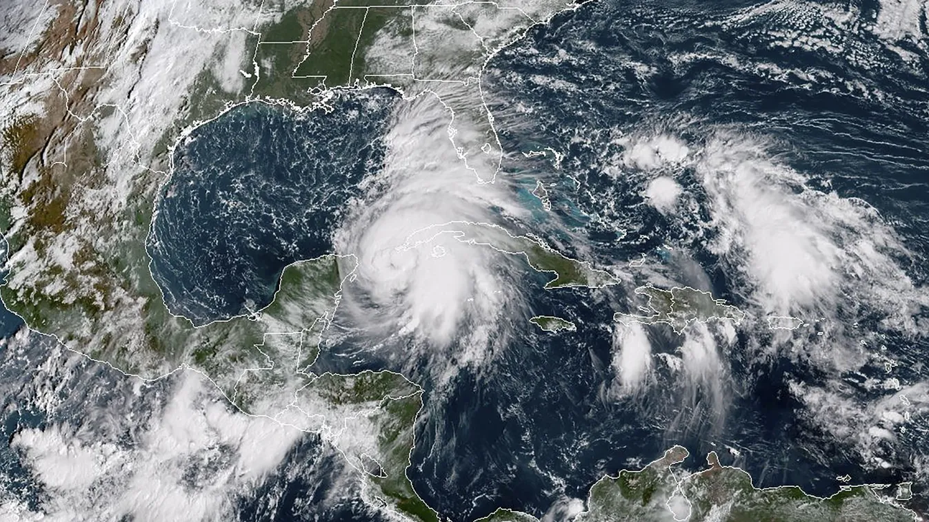 Horizontal STORM This NOAA/RAMMB satellite image taken on October 8, 2018 at 14:30 UTC shows Tropical storm Michael off the US Gulf Coast.
Tropical storm Michael was upgraded to a Category 1 hurricane on October 8, 2018 as it barreled toward the US Gulf C