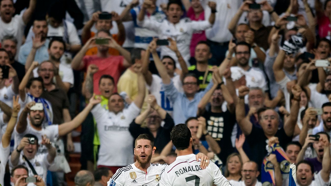 Real Madrid's Portuguese forward Cristiano Ronaldo (R), Real Madrid's defender Sergio Ramos celebrate after scoring during the UEFA Champions League semifinal second leg football match Real Madrid FC vs Juventus at the Santiago Bernabeu stadium in Madrid 