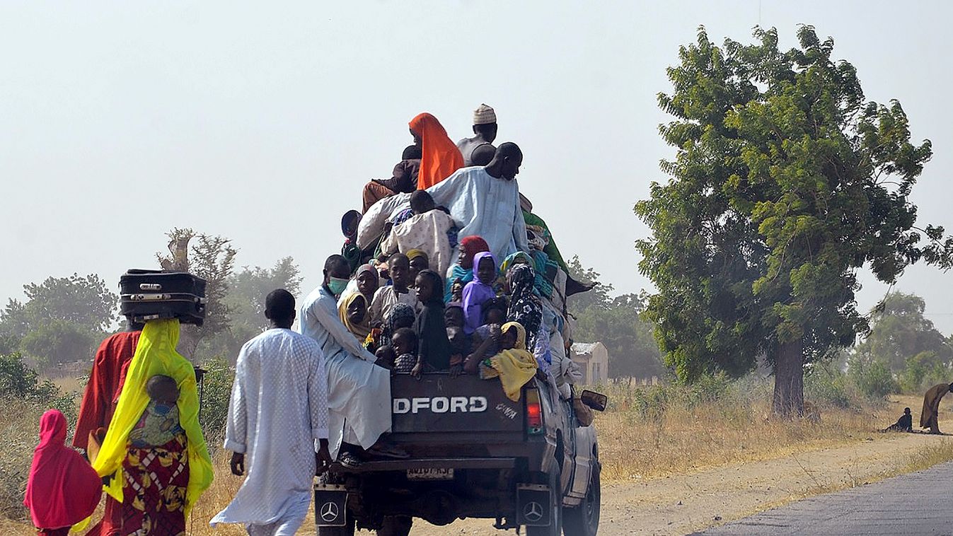Horizontal A loaded truck wait to carry people fleeing from Boko Haram Islamists at Mairi village outskirts of Maiduguri capital of northeast Borno State, on February 6, 2016.
Suspected Boko Haram Islamists have killed four people following raids on villa