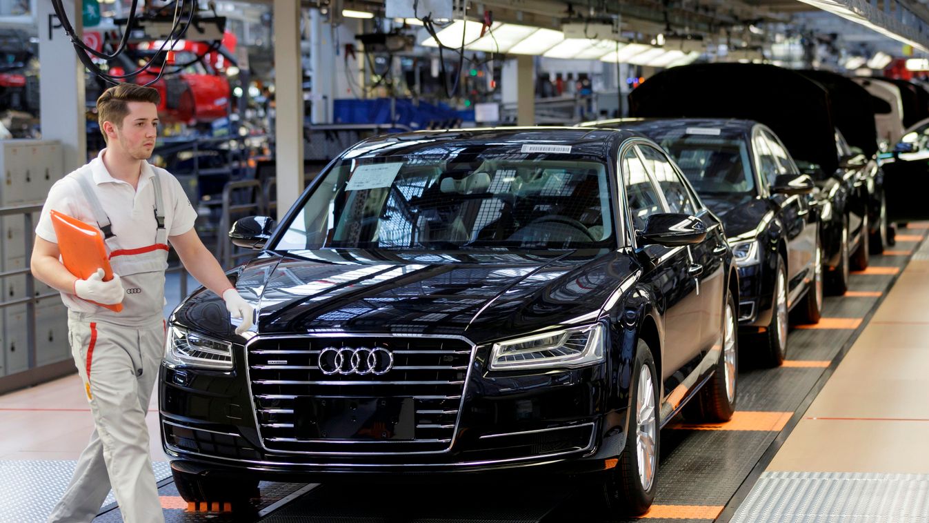 lsw LOGO MAKING SQUARE FORMAT An employee walks past the A8 model at the Audi production plant in Neckarsulm, Germany, 21 May 2015. The Audi company's general assembly will be held on 22 May 2015. Photo: Ronald Wittek/dpa 