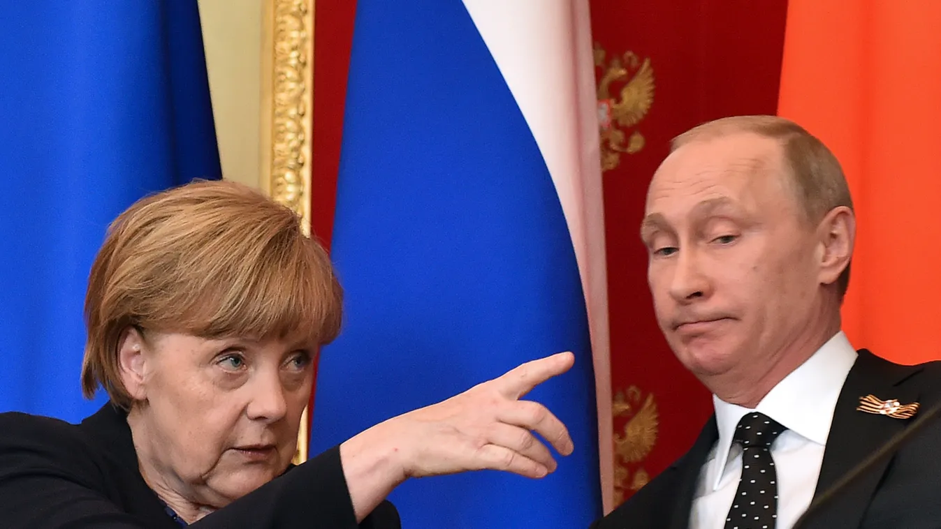 HORIZONTAL DIPLOMACY OFFICIAL VISIT COMMEMORATION VICTORY SECOND WORLD WAR CHANCELOR WOMAN PRESS CONFERENCE PRESIDENT EXPRESSION FLAG GESTURE German Chancellor Angela Merkel (L) gestures as Russian President Vladimir Putin looks on during a joint press co