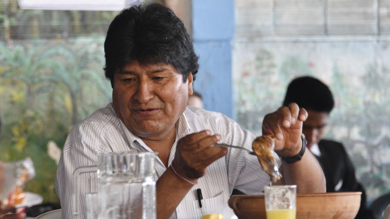 vote Horizontal Bolivia's President and presidential candidate Evo Morales participates in a breaksfast with reporters and supporters before casting his vote during presidential elections in Villa 14 de Septiembre, Chapare, Cochabamba department, Bolivia 