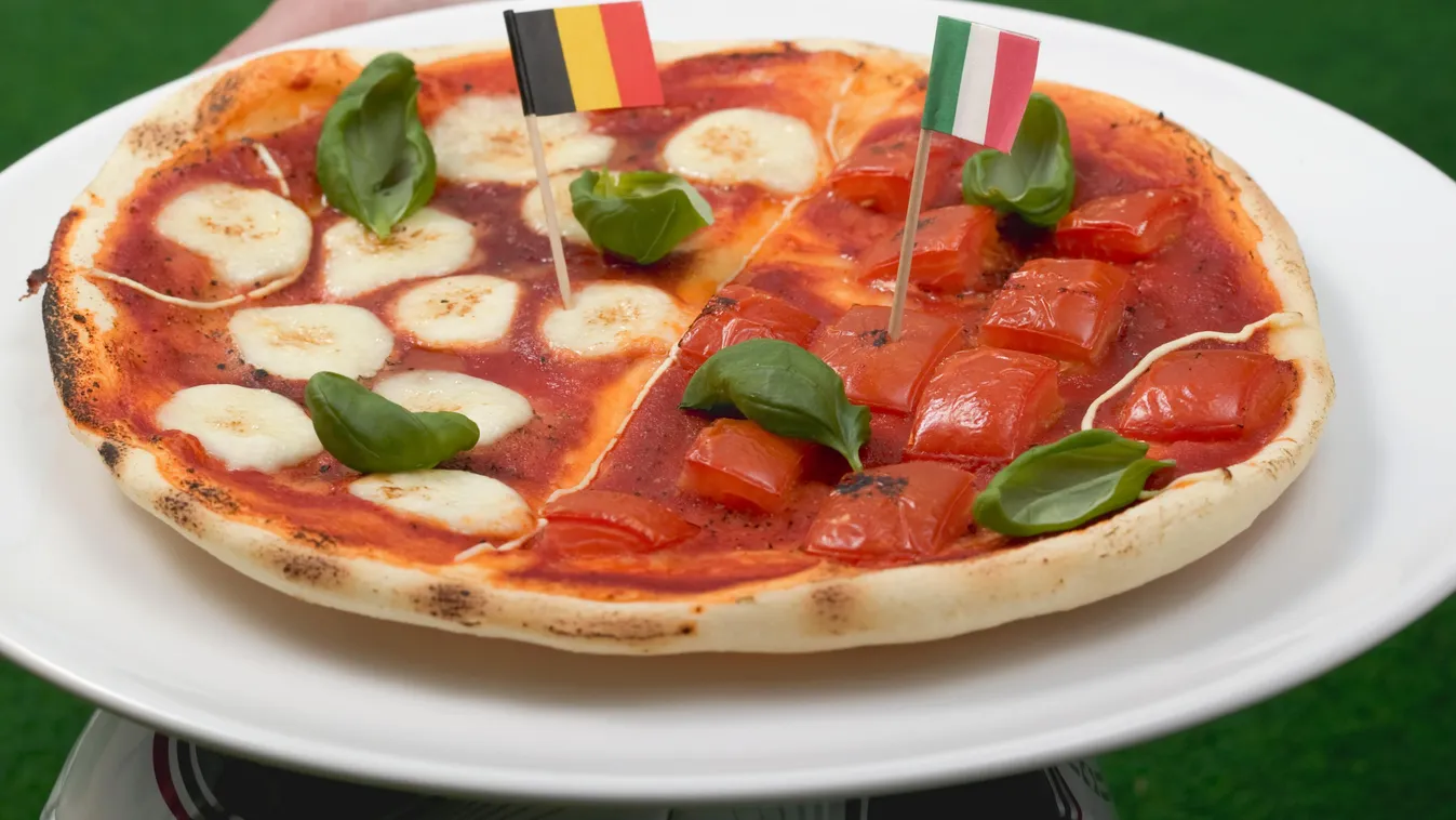 Hands holding tomato and mozzarella pizza with flags ADULT ALONE BASIL Being Held Being Made Being Served CHEESE Cheeses Classic Herbs Complete Cuisine Cuisines DISH Dishes DIY Do It Yourself Do-It-Yourself Ec Entire EUROPE EUROPEAN CHAMPIONSHIP European 