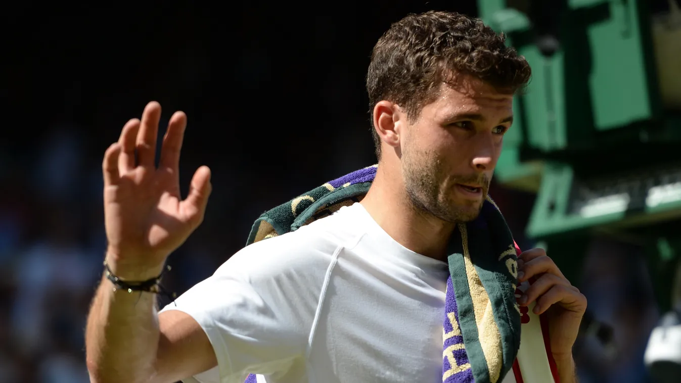 Bulgaria's Grigor Dimitrov leaves Centre Court after losing his men's singles semi-final match against Serbia's Novak Djokovic on day 11 of the 2014 Wimbledon Championships at The All England Tennis Club in Wimbledon, southwest London, on July 4, 2014. Dj