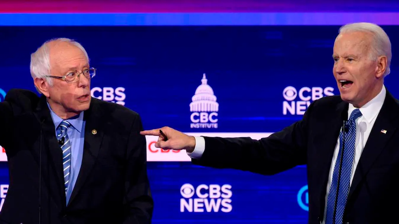 TOPSHOT-US-VOTE-2020-DEMOCRATS-DEBATE-POLITICS-ELECTION panoramic,Politics,Election,Charleston TOPSHOT - Democratic presidential hopefuls Vermont Senator Bernie Sanders (L) and former Vice President Joe Biden gesture as they participate in the tenth Democ