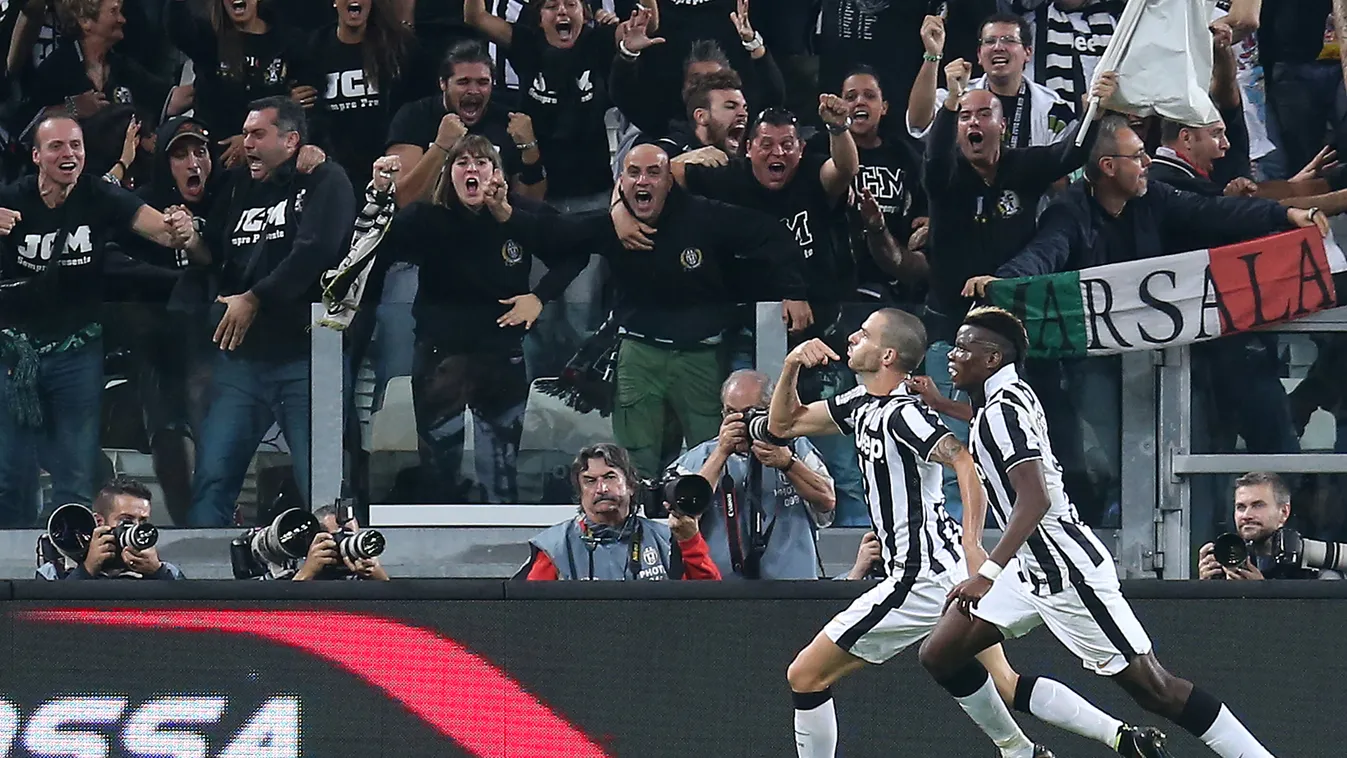 504225463 Juventus' defender Leonardo Bonucci celebrates after scoring during the Italian Serie A football match Juventus Vs AS Roma on October 5, 2014 at Juventus  Stadium in Turin.  AFP PHOTO / MARCO BERTORELLO 