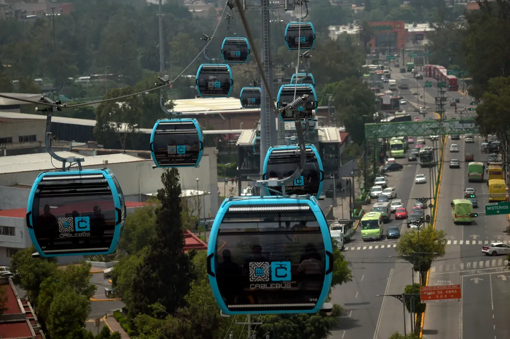 transport Horizontal Passengers travel on the cable car system dubbed Cablebus after its inauguration outskirts of Mexico City, on July 12, 2021. - Mexico City put into operation on Monday a cable car system that promises to save time for thousands of use