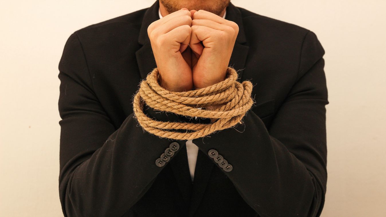 a young business man with tied hands tied hands human bondage slave stress caucasian man captive female girl young transaction phone Employee Handcuffed Beautiful bound up kidnap help a young business man with tied hands 