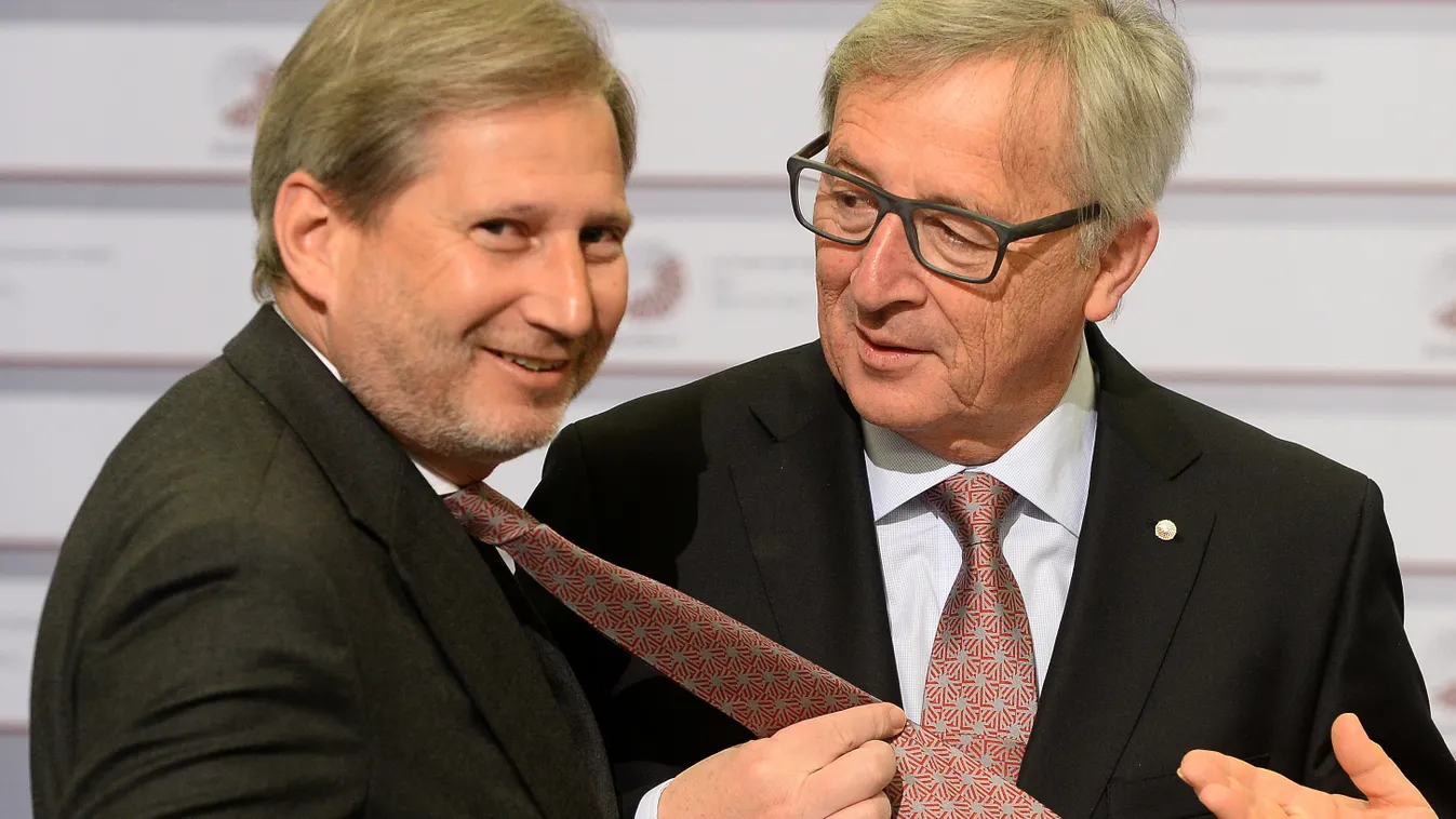 OFFBEAT Johannes Hahn, Commissioner for European Neighbourhood Policy (L) jokes about a tie with President of the European Commission Jean-Claude Juncker on the second day of the fourth European Union (EU) eastern Partnership Summit in Riga, on May 22, 20