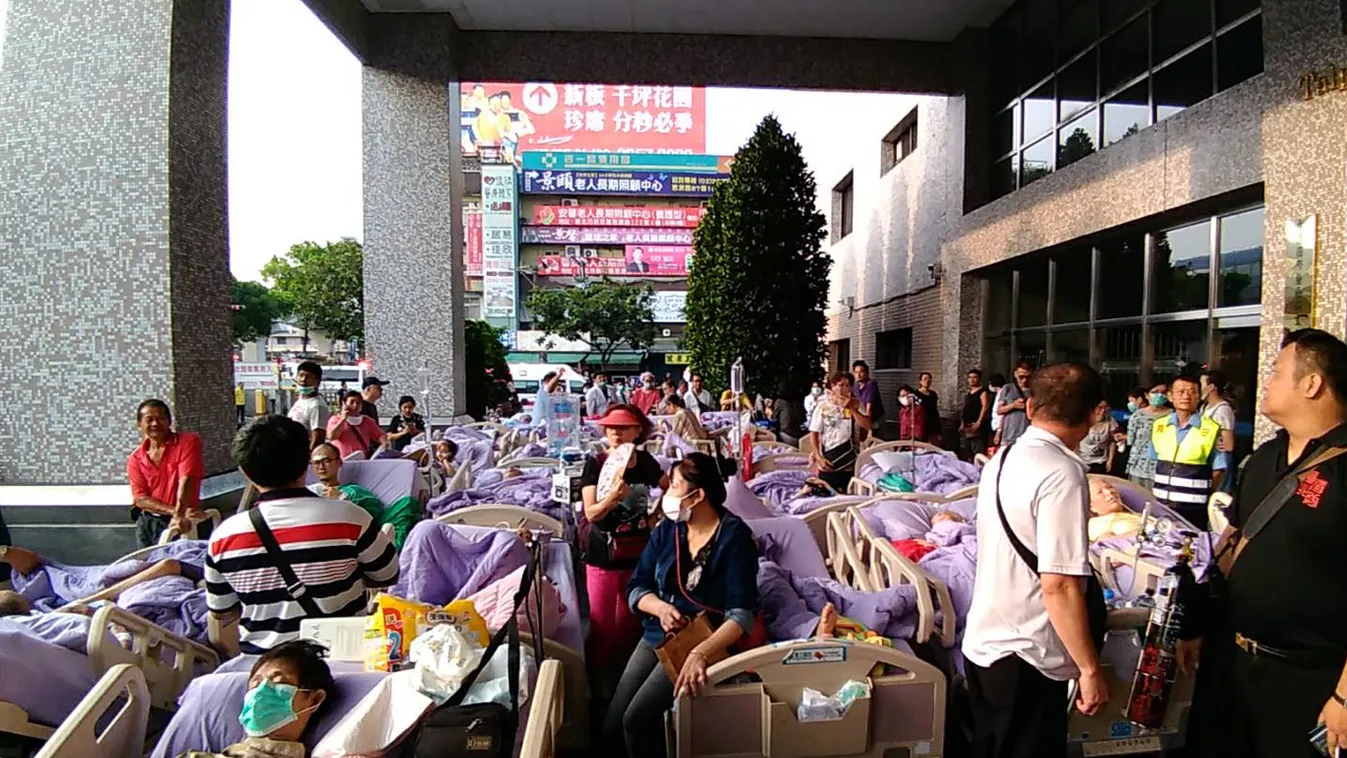 fire Horizontal This photograph by Taiwan agency CNA Photo taken on August 13, 2018 shows bed-ridden patients outside the entrance to a hospital in New Taipei City after being evacuated following a fire on the seventh floor of a hospice.
Nine people were 
