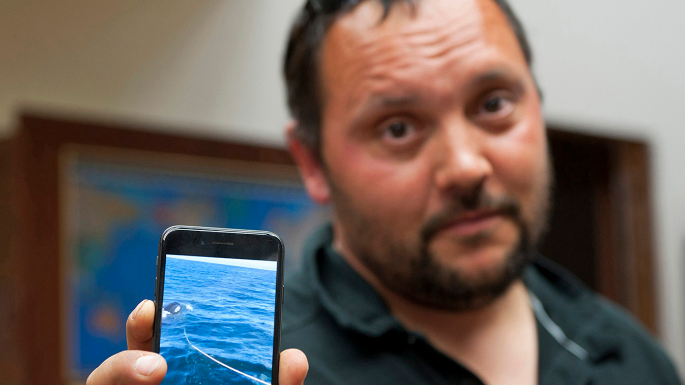 Victor Littlefield orca attack In this Monday, July 24, 2017 photo Victor Littlefield holds up a cellphone video of an orca whale pulling a line off his boat near Sitka, Alaska. Littlefield of Sitka says his boat was attacked by an orca during a fishing e