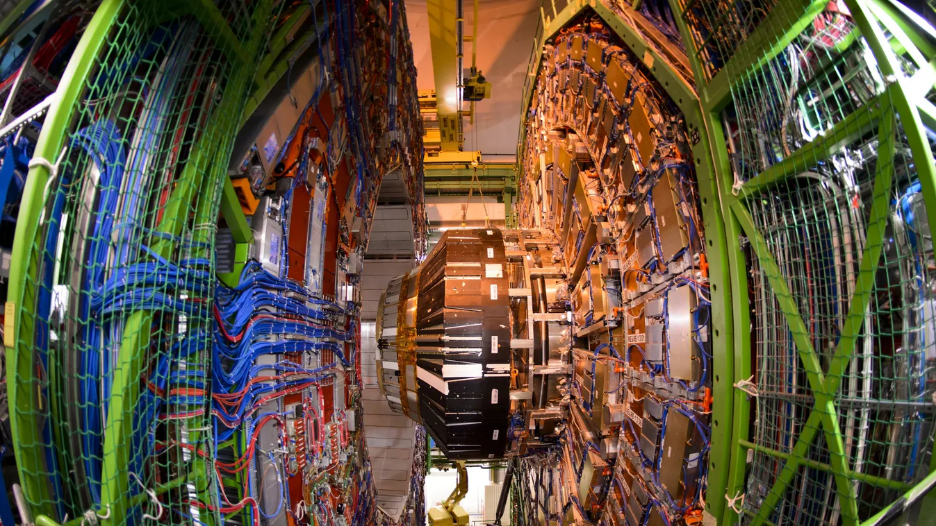 - TO GO WITH AFP STORY BY JONATHAN FOWLER
A worker stands below the Compact Muon Solenoid (CMS), a general-purpose detector at the European Organisation for Nuclear Research (CERN) Large Hadron Collider (LHC), during maintenance works on July 19, 2013 in 
