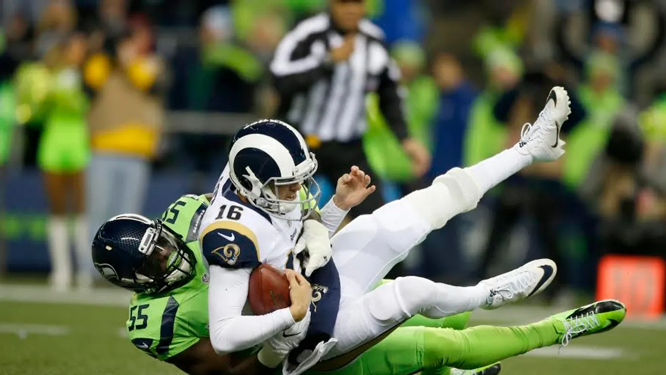 SEATTLE, WA - DECEMBER 15: Defensive end Frank Clark #55 of the Seattle Seahawks brings down quarterback Jared Goff #16 of the Los Angeles Rams at CenturyLink Field on December 15, 2016 in Seattle, Washington.   Otto Greule Jr/Getty Images/AFP 