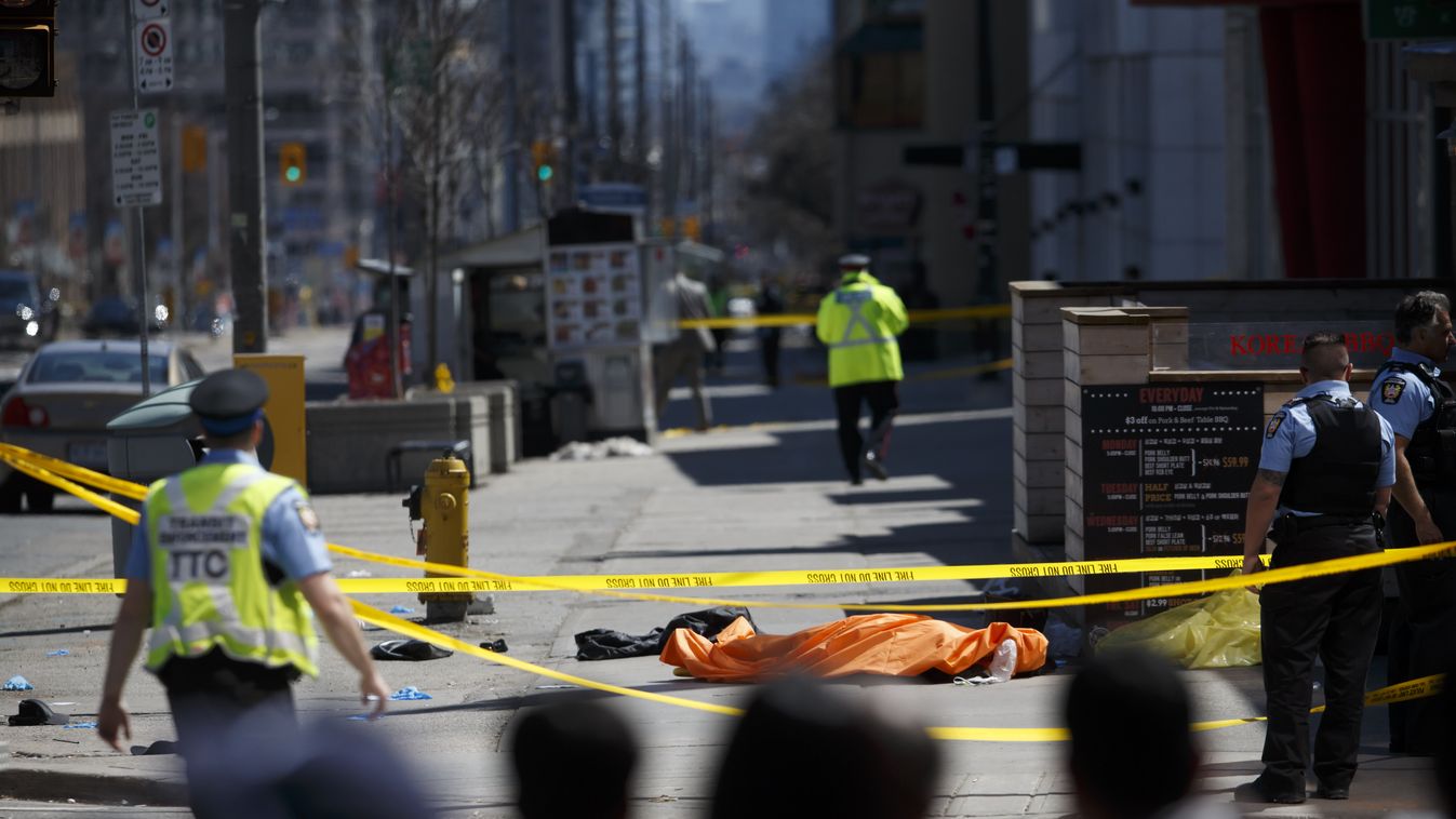 Rental Van Plows Into Pedestrians On Toronto Street, Injuring At Least Eight GettyImageRank1 PLOUGH Human Body DEATH HORIZONTAL Dead Person Van - Vehicle Canada On Top Of Ontario - Canada VIOLENCE Toronto Accidents and Disasters LAW Pedestrian Laying Tarp