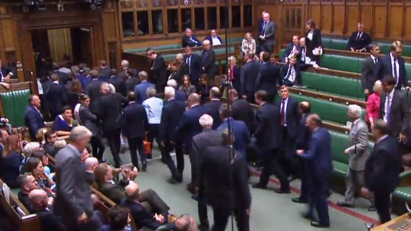 politics Horizontal A video grab from footage broadcast by the UK Parliament's Parliamentary Recording Unit (PRU) shows members of parliament walking from the House of Commons to the House of Lords in London on September 10, 2019, during the ceremony to p