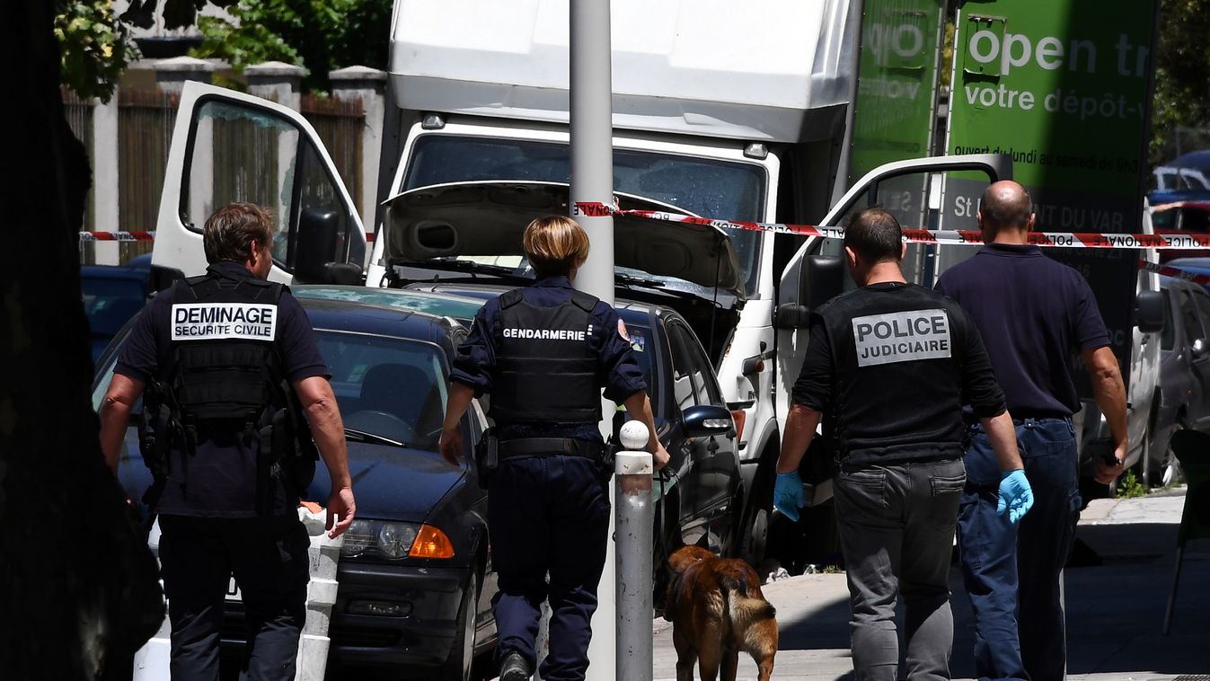 investigation Horizontal French police officers search a truck in a street of Nice on July 15, 2016, near the building where the man who drove a truck into a crowd watching a fireworks display the day before reportedly lived.
A Tunisian-born man zigzagged