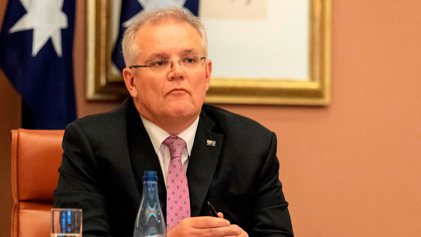 G20 Teleconference virus disease pandemic diplomacy Horizontal Australian Prime Minister Scott Morrison (C) attends a videoconference with G20 leaders to discuss the COVID-19 coronavirus, at the Parliament House in Canberra on March 26, 2020. - Leaders of