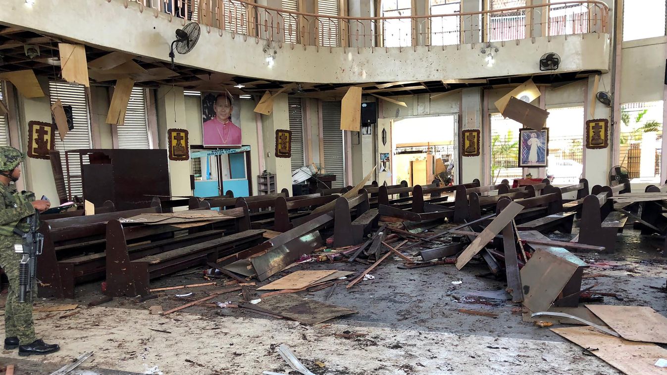 Horizontal UNREST This handout photo released by Armed Forces of the Philippines (AFP) Public Information Office (PIO) Western Mindanao Command (WESTMINCON) taken on January 27, 2019, shows debris inside a Catholic Church where two bombs exploded in Jolo,