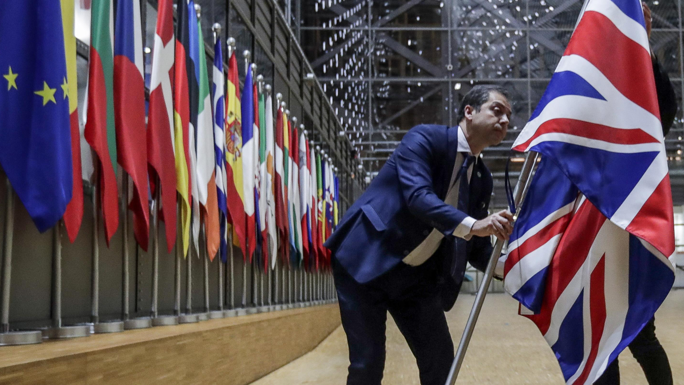 diplomacy politics Horizontal EU Council staff members remove the United Kingdom's flag from the European Council building in Brussels on Brexit Day, January 31, 2020. - Britain leaves the European Union at 2300 GMT on January 31, 2020, 43 months after th