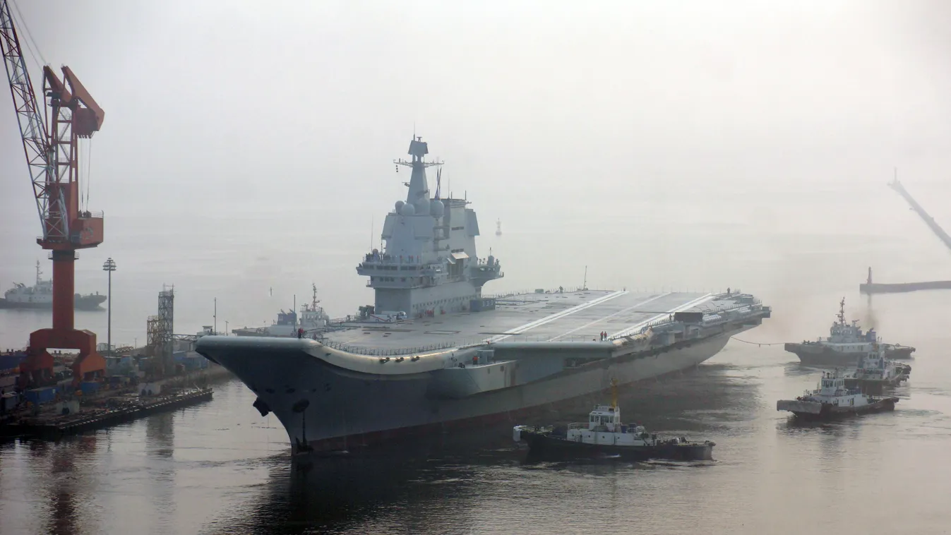 China's first domestically built aircraft carrier, the Type 001A, berths at the shipyard of Dalian Shipbuilding Industry Co., Ltd. before a sea trial in Dalian city, northeast China's Liaoning province, 13 May 2018.  China Chinese Liaoning Dalian home bui
