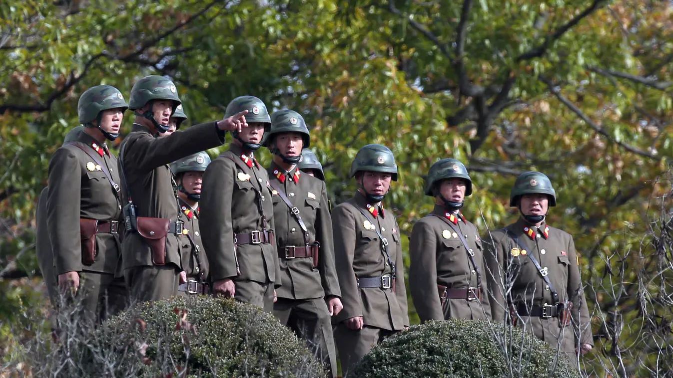 North Korean soldiers look at the South side while US Defense Secretary Ashton Carter visits the truce village of Panmunjom in the Demilitarized Zone dividing the two Koreas on November 1, 2015.  Carter visited the Demilitarized Zone (DMZ) dividing the Ko