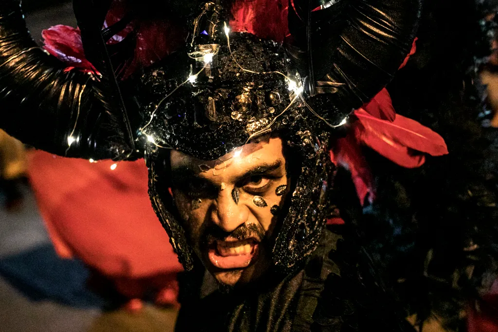 A reveller takes part in the Devils parade at the Devil's Carnival, in Riosucio, Caldas department, Colombia, on January 5, 2019. - The Devil's Carnival -which runs from January 4 to 9 and takes place every two years- has its origins in the 19th century w