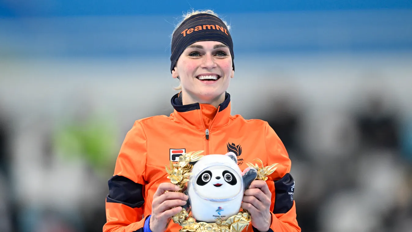 Gold medallist Netherlands' Irene Schouten celebrates during the venue ceremony for the women's speed skating 5000m event during the Beijing 2022 Winter Olympic Games at the National Speed Skating Oval in Beijing on February 10, 2022. (Photo by WANG Zhao 