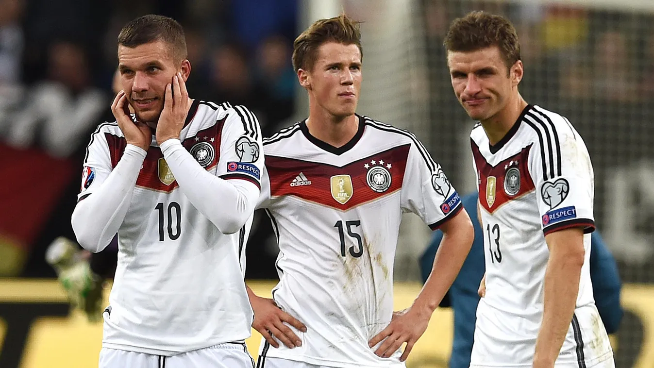 510260433 (From L) Germany's midfielder Lukas Podolski, defender Erik Durm and midfielder Thomas Mueller react after the UEFA Euro 2016 Group D qualifying football match Germany vs Republic of Ireland in Gelsenkirchen, western Germany on October 14, 2014.
