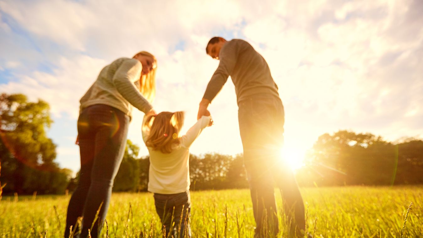 Out of focus backgrounds.Happy family concept. Two Parents Baby Girls Women Females Men Males Group Of People Parking Beauty In Nature Adoption Grass Dawn Cute Child Smiling Beauty Healthy Lifestyle Caucasian Ethnicity Togetherness Joy Happiness Love Conc