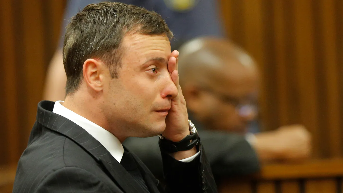 South African Paralympic athlete Oscar Pistorius cries  in the dock during the verdict in his murder trial, Pretoria, South Africa, on September 11, 2014. Pistorius stands trial for the premeditated murder of his model girlfriend Reeva Steenkamp in Februa