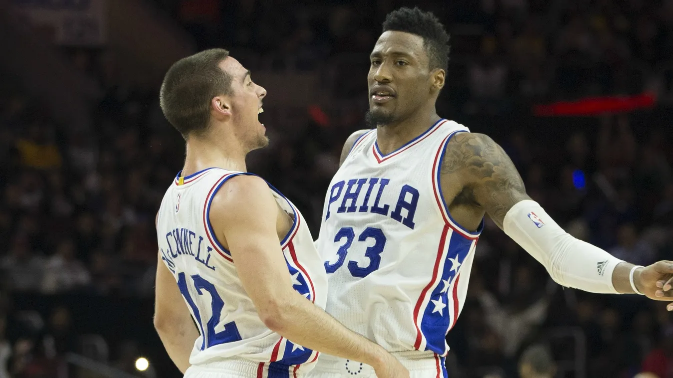 T.J. McConnell #12 and Robert Covington #33 of the Philadelphia 76ers react in the game against the Los Angeles Lakers on December 1, 2015 at the Wells Fargo Center in Philadelphia, Pennsylvania. 