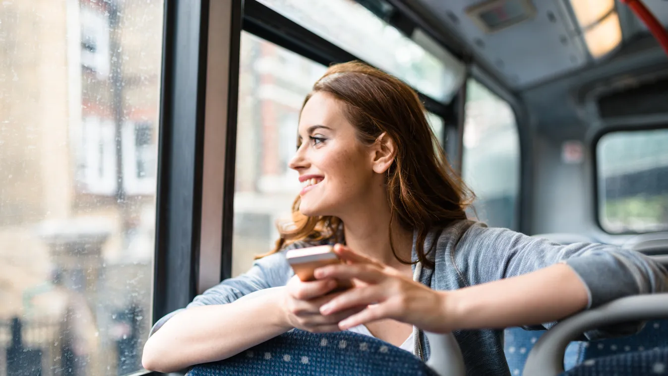 woman inside a bus in london on the phone Smart Phone Beautiful Capital Cities Serene People Travel Using Phone Adolescence Teenagers Only People Traveling Tourism Toothy Smile Public Transportation Text Messaging Vehicle Interior One Woman Only Young Wom