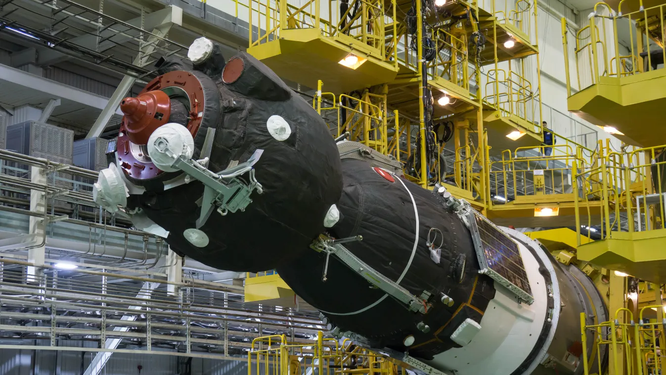 jsc2018e025511 - In the Integration Facility at the Baikonur Cosmodrome in Kazakhstan, the Soyuz MS-08 spacecraft is rotated to a horizontal position March 14 to be encapsulated in the upper stage of a Soyuz booster rocket. Expedition 55 crewmembers Drew 