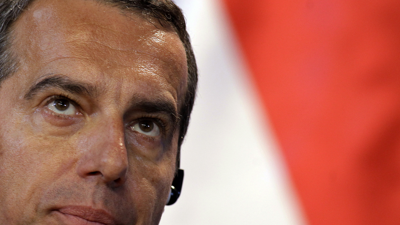 Horizontal Austrian Chancellor Christian Kern reacts during a joint press conference with the Hungarian Prime Minister, in the Delegation Hall of the parliament building in Budapest, Hungary, on July 26, 2016. / AFP PHOTO / PETER KOHALMI 