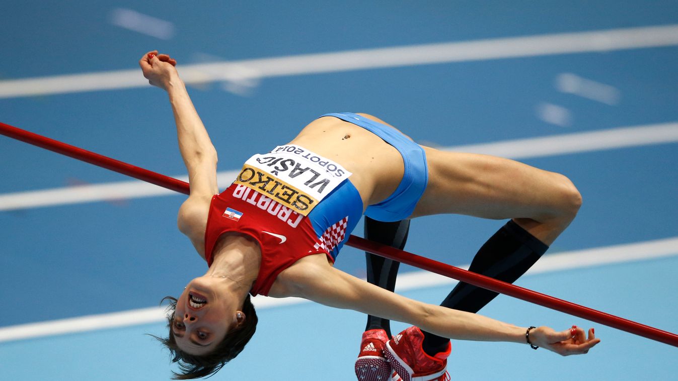 475782041 Croatia's Blanka Vlasic competes in the Women High Jump Final event at the IAAF World Indoor Athletics Championships in the Ergo Arena in the Polish coastal town of Sopot, on March 8, 2014.  AFP PHOTO / ADRIAN DENNIS 