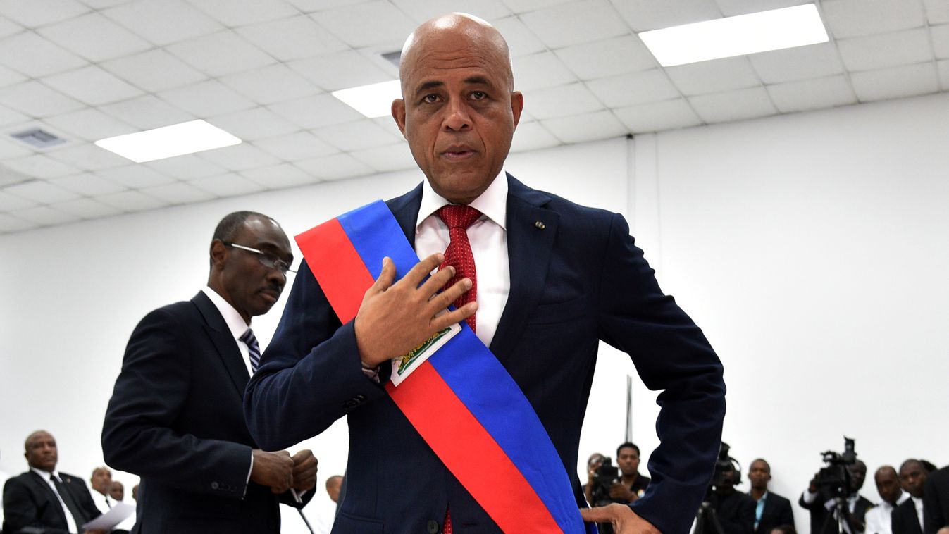 Horizontal PRESIDENT POLITICS Haitian President, Michel Martelly arrives at the Haitian Parliament in Port-au-Prince February 7, 2016 to deliver his last address to the nation and to turn over the presidential sash, as his presidential mandate ended. 
Hai