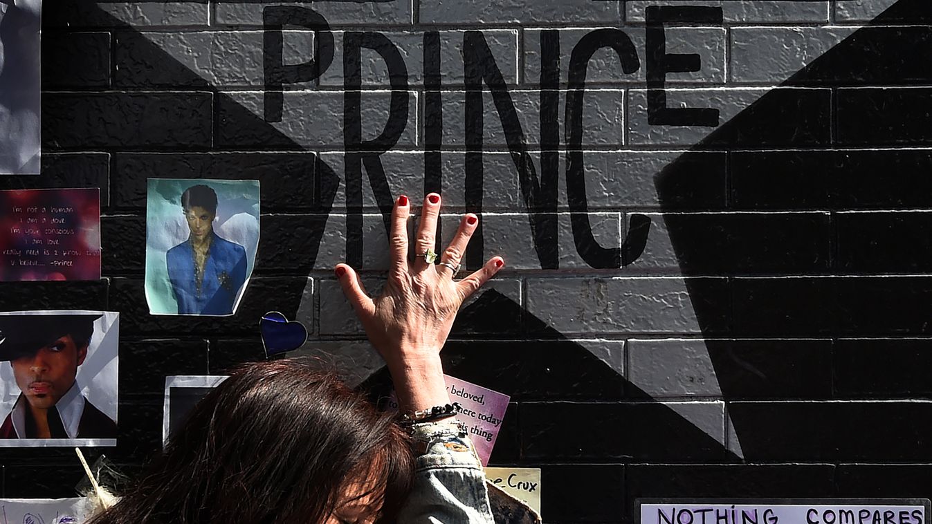 music Horizontal Prince fan Ann Sawatzky touches the star of music legend Prince who died suddenly at the age of 57, at the First Avenue club where he started his music career in Minneapolis, Minnesota, on April 23, 2016.
There was no evidence of trauma o