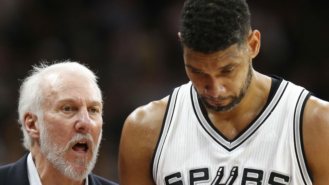 San Antonio head coach Gregg Popovich talks with Tim Duncan #21 of the San Antonio Spurs as he comes out against the Oklahoma City Thunder at AT&T Center on April 12, 2016 in San Antonio, Texas 