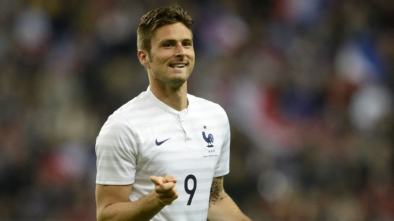 493494411 France's forward Olivier Giroud gestures as he celebrates after scoring a goal during a friendly football match between France and Norway at the Stade de France in Saint-Denis near Paris, on May 27, 2014, ahead of the 2014 FIFA World Cup footbal