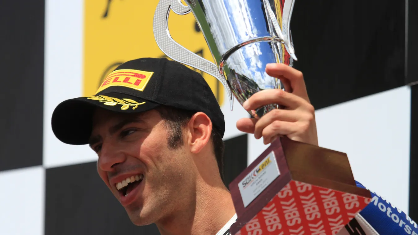 - HORIZONTAL MOTORCYCLING WINNER PODIUM PORTRAIT TROPHY Italy's Marco Melandri celebrates first place after the first race of the Superbike World Championship on July 22, 2012 in Brno. AFP PHOTO/RADEK MICA 