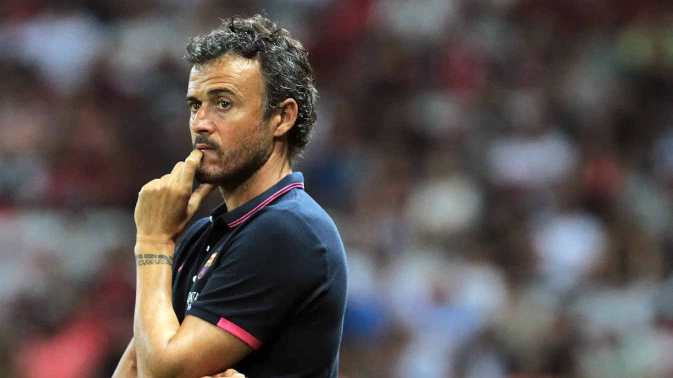 Barcelona's Spanish head coach Luis Enrique looks on during a friendly football match Nice (OGCN) vs Barcelona (FCB) on August 2, 2014 at the Allianz Riviera stadium, in Nice, southeastern France. AFP PHOTO / JEAN CHRISTOPHE MAGNENET 