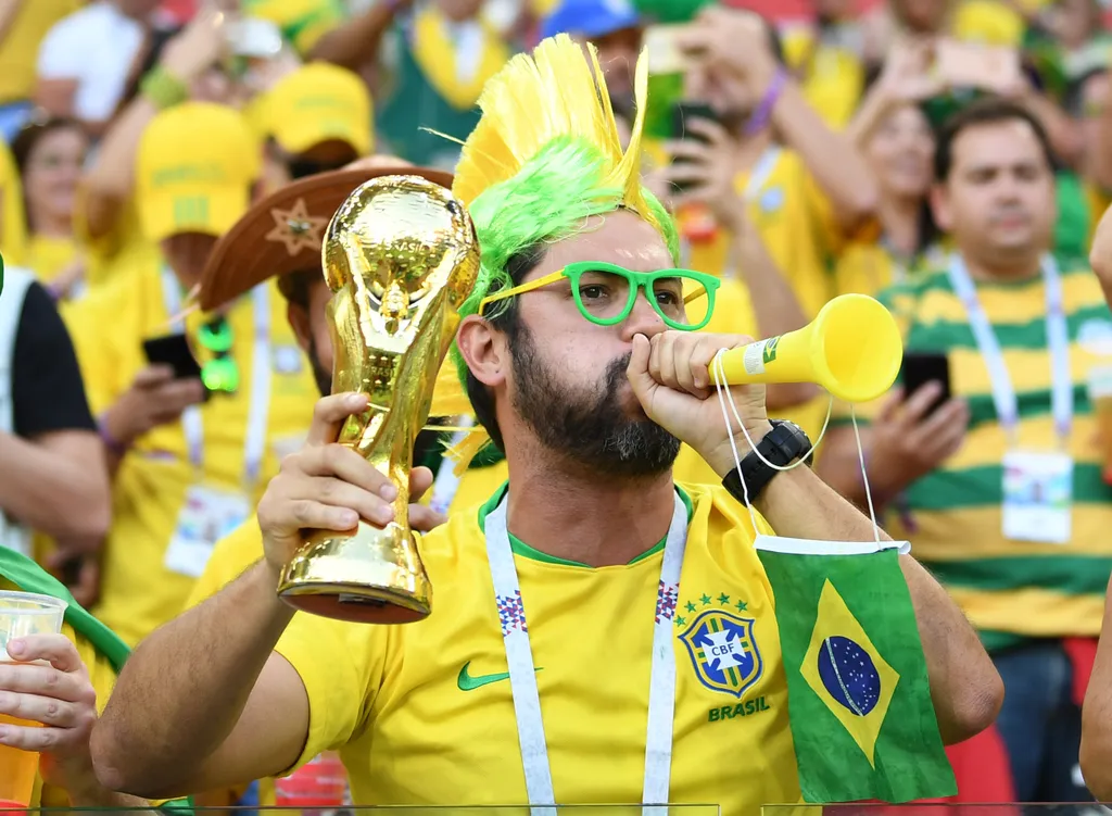 A Brazilian fan cheers before the start of the Russia 2018 World Cup Group E football match between Serbia and Brazil at the Spartak Stadium in Moscow on June 27, 2018. / AFP PHOTO / Francisco LEONG / RESTRICTED TO EDITORIAL USE - NO MOBILE PUSH ALERTS/DO