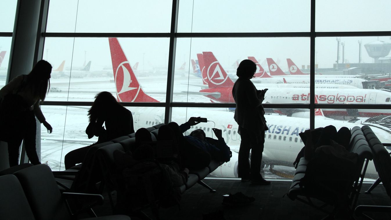 Istanbul TURKEY Ataturk Airport weather adverse weather SQUARE FORMAT ISTANBUL, TURKEY - DECEMBER 31: Passengers wait at Ataturk Airport in Istanbul, Turkey on December 31, 2015, after announcement of further flight cancellations due to adverse weather. W