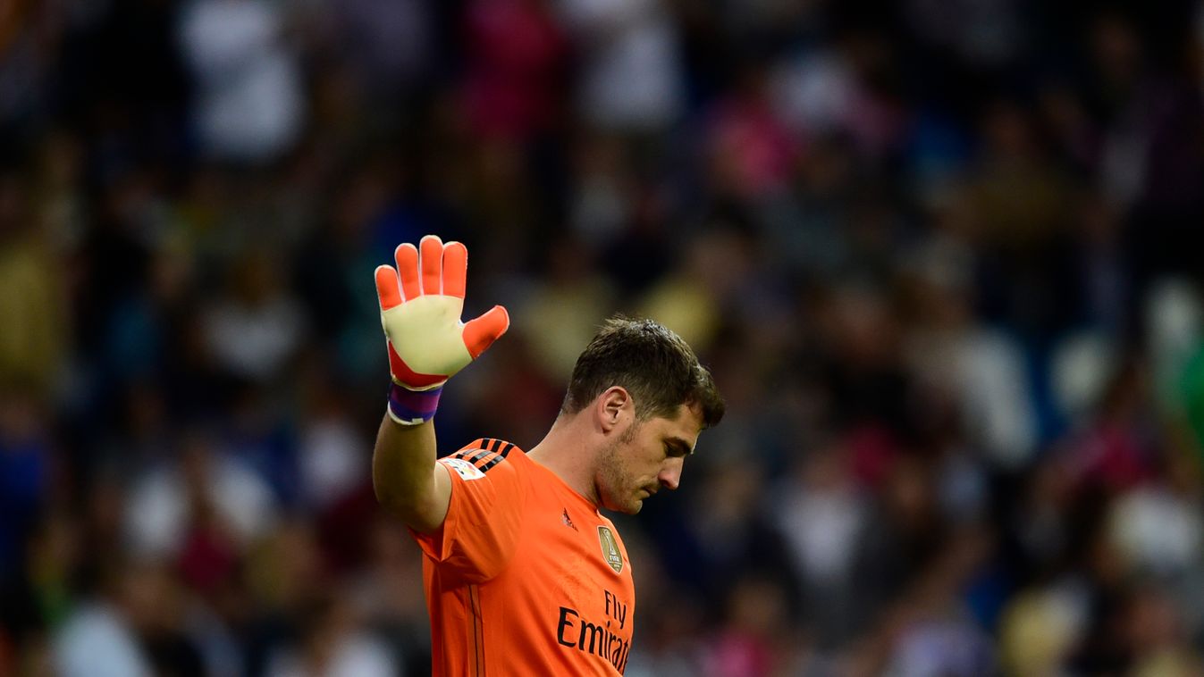 Real Madrid's goalkeeper Iker Casillas gestures during the Spanish league football match Real Madrid CF vs Getafe CF at the Santiago Bernabeu stadium in Madrid on May 23, 2015.   AFP PHOTO / PIERRE-PHILIPPE MARCOU 