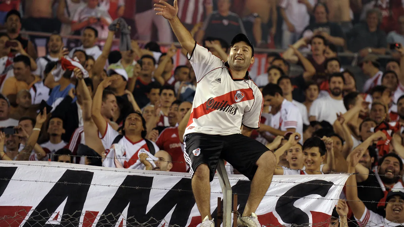 HORIZONTAL Supporters of River Plate celebrate after their team defeating to Boca Juniors in their Copa Sudamericana 2014 semifinal second leg football match at the Monumental stadium in Buenos Aires, Argentina, on November 27, 2014.   River won 1-0 and q