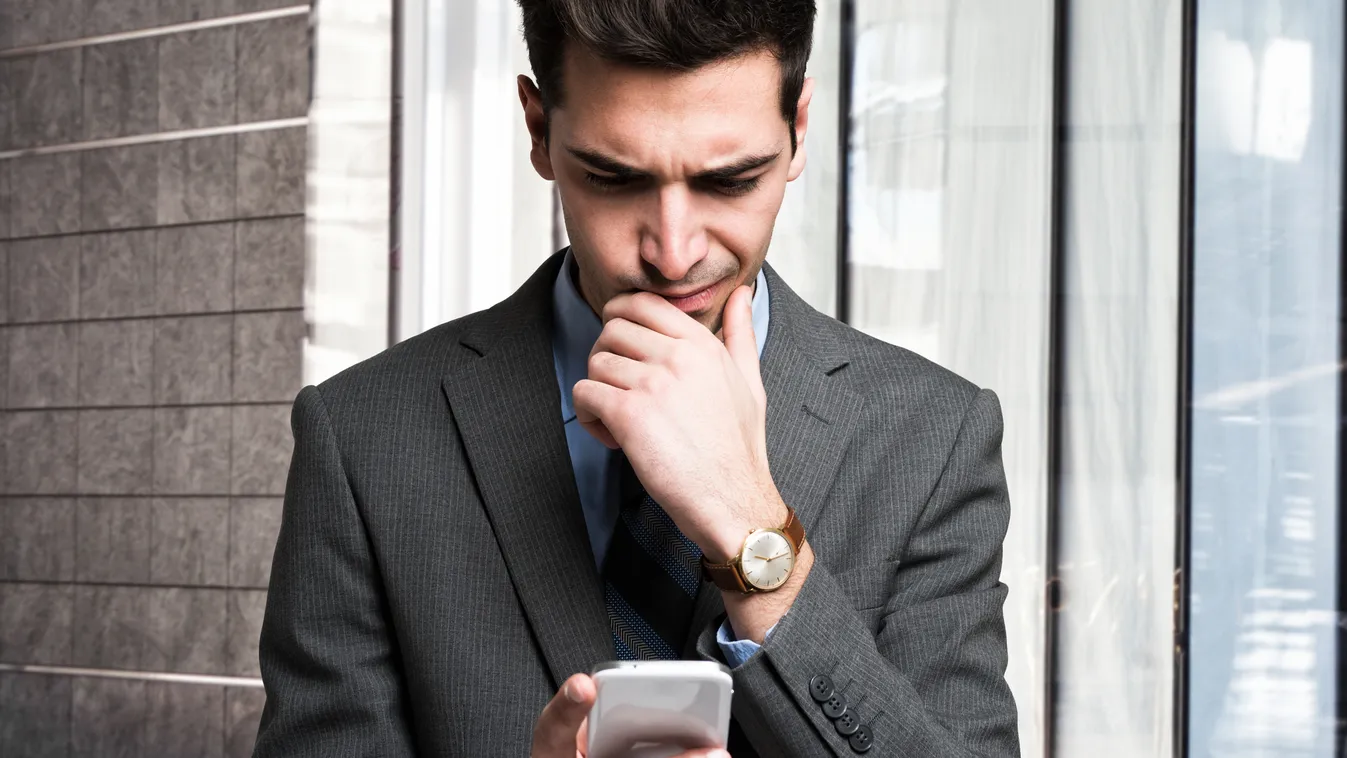 Man reading information on his cellular device Smart Phone Electrical Equipment Businessman Men Searching Handbook Counting E-Mail Message Reading Thinking Complexity Learning Backgrounds Toughness Confusion Problems Exhaustion Adversity Concentration Emo