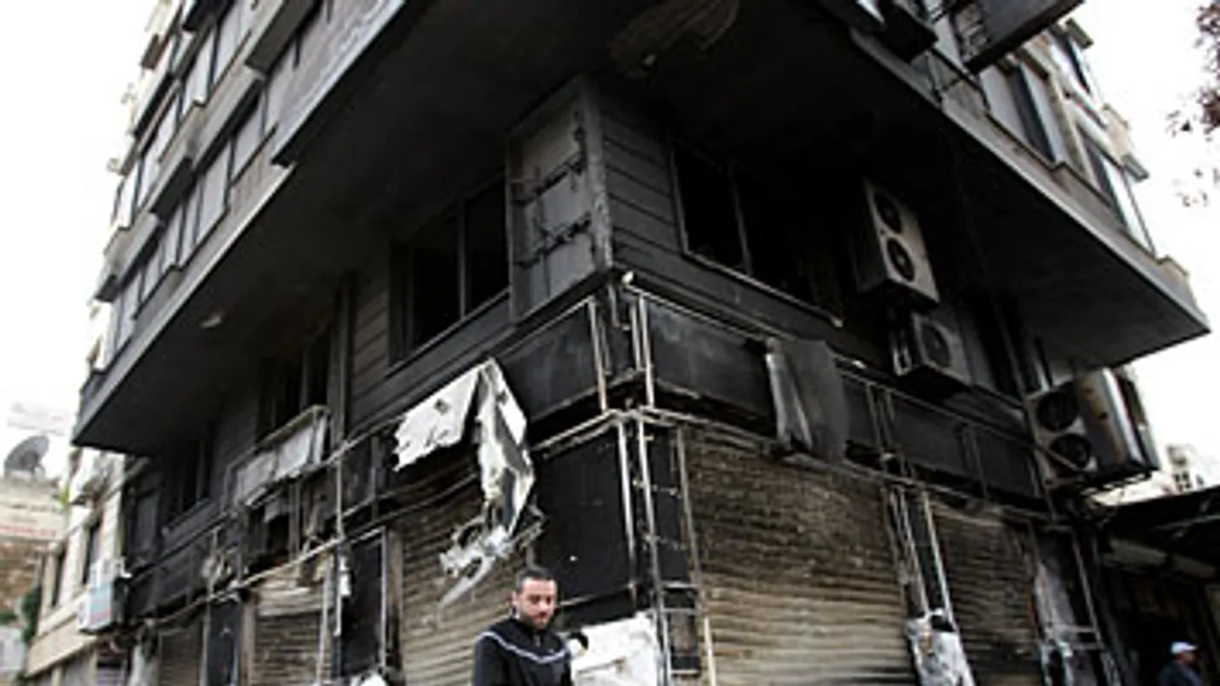 Szíria, kormányellenes tüntetések, kiégett üzlet Latakiában