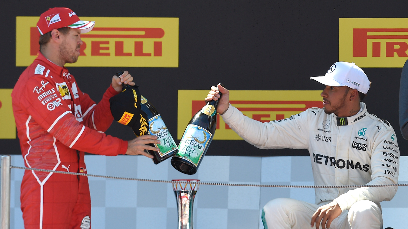 - Horizontal (L to R) Ferrari's German driver Sebastian Vettel, Mercedes' British driver Lewis Hamilton  celebrate on the podium after the Spanish Formula One Grand Prix on May 14, 2017 at the Circuit de Catalunya in Montmelo on the outskirts of Barcelona